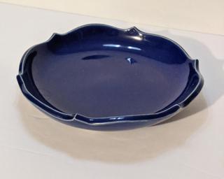 An eye-catching footed blue dish for your dresser.