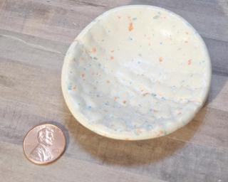 A sweet little speckled white dish for your dresser.
