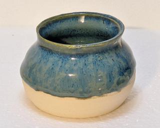 Adorn your home with this one of a kind little blue vase.