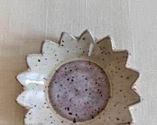 This sweet little dish is made from mid fire brown speckled clay with creamy white glazes that breaks over the edges, really highlighting the speckles underneath.