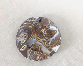 A sweet little marbled dish for your dresser.
