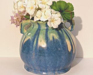 This is quite the eye-catching vase for your shelf. glaze remnants around bottom