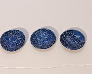 A set of three sweet little blue dishes for your dresser.