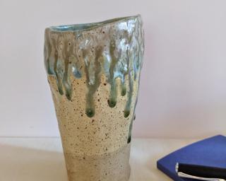 A lovely and unique vase for your shelf.