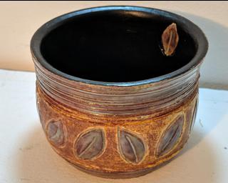 Adorn your home with this one of a kind carved leaf ceramic planter.