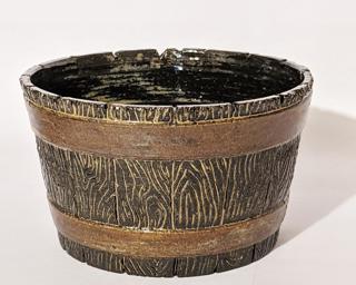 Adorn your home with this rustic glazed planter.