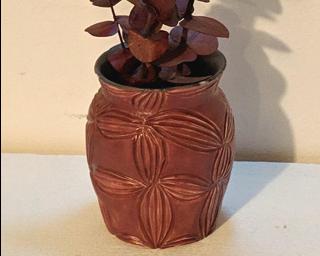 Adorn your home with this one of a kind carved vase.
