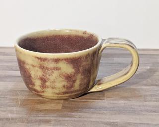 A lovely ceramic mug with a unique two toned glaze.