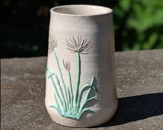 Adorn your home with this one of a kind little vase.